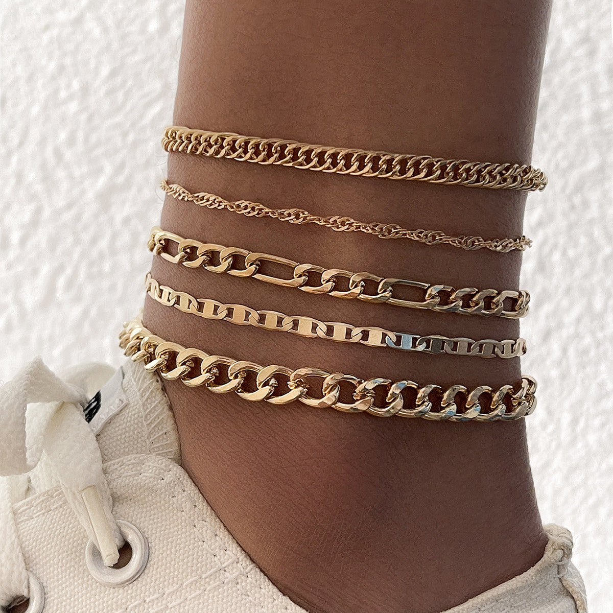 5-teiliges Set aus dicken und dünnen Armbändern und Fußkettchen